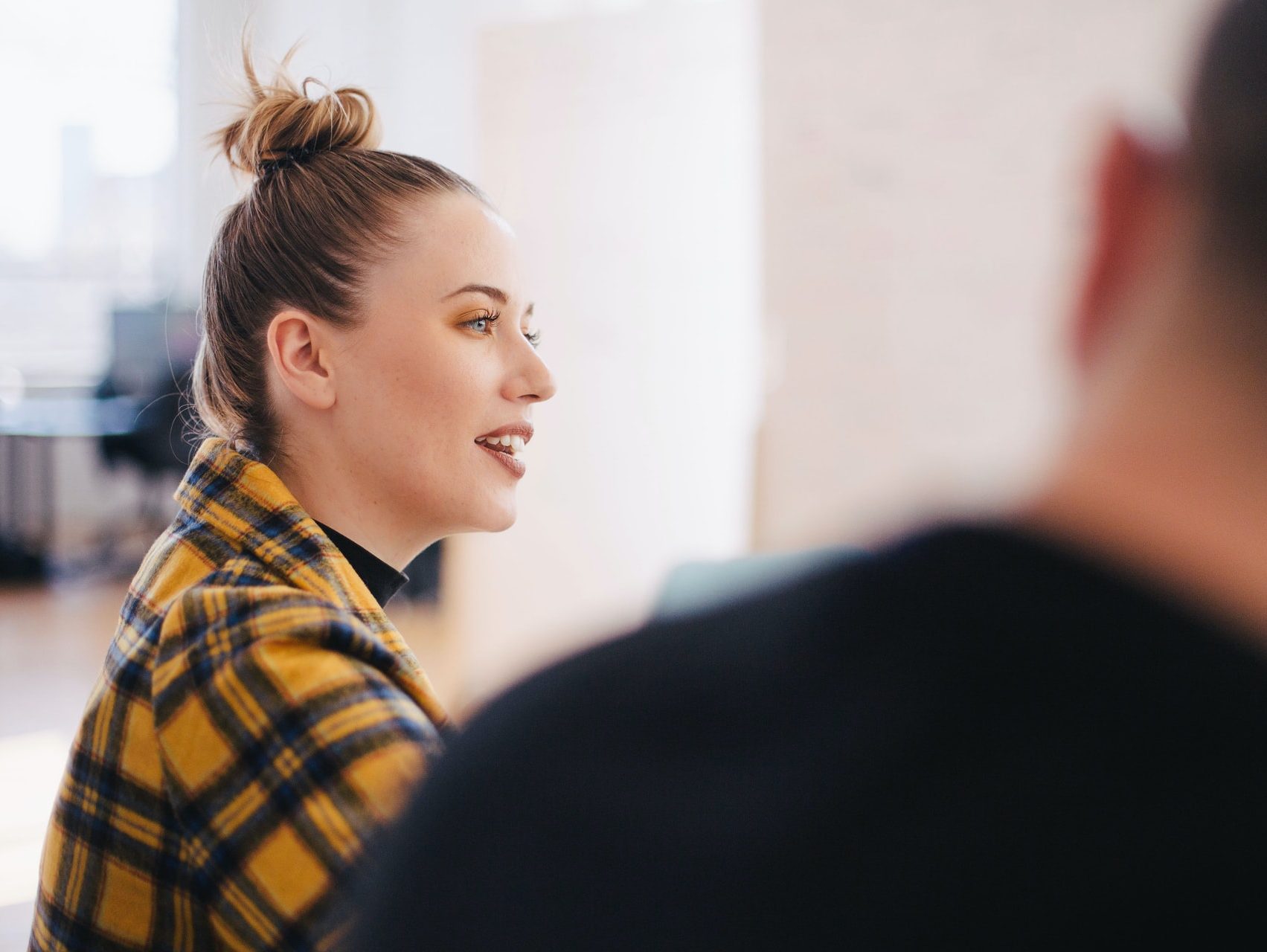 woman wearing yellow and black plaid shirt