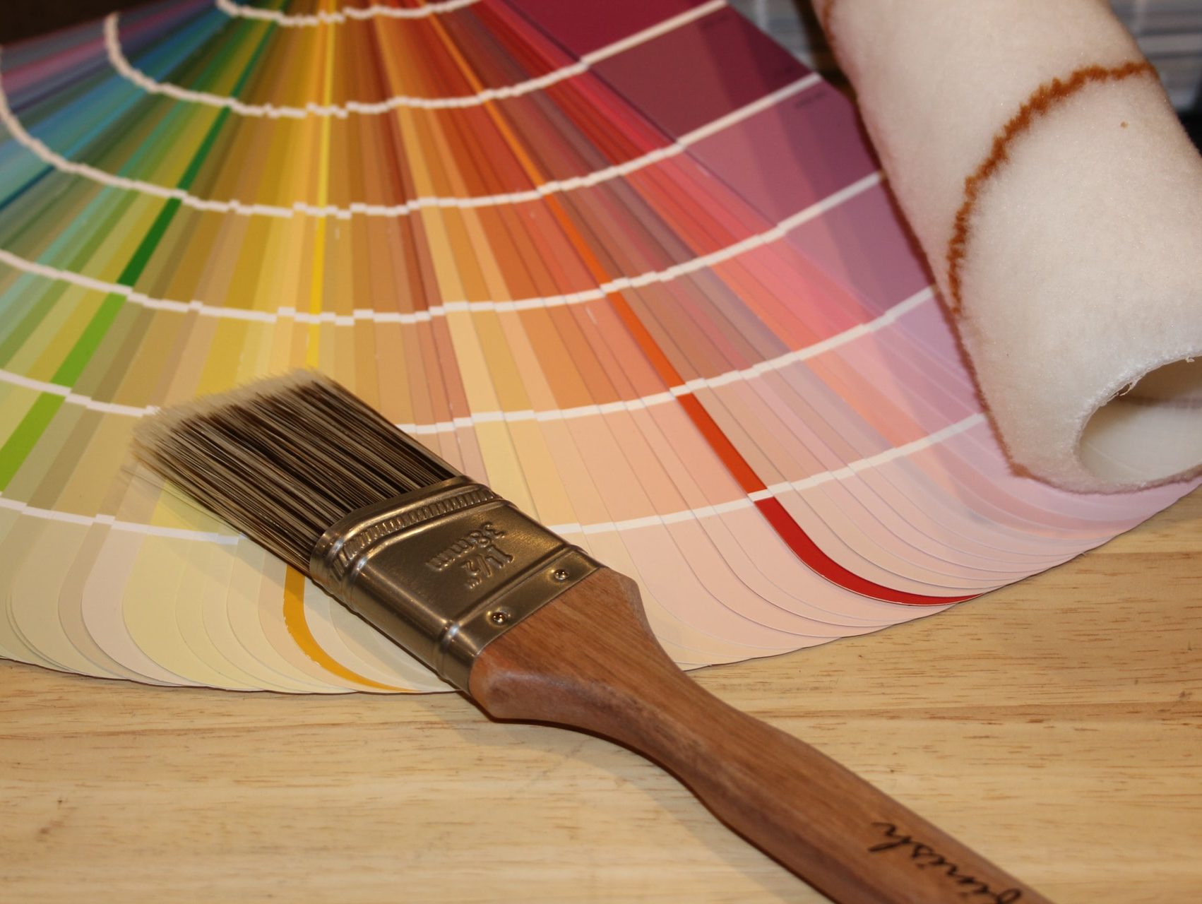 brown paint brush on white and red plaid textile